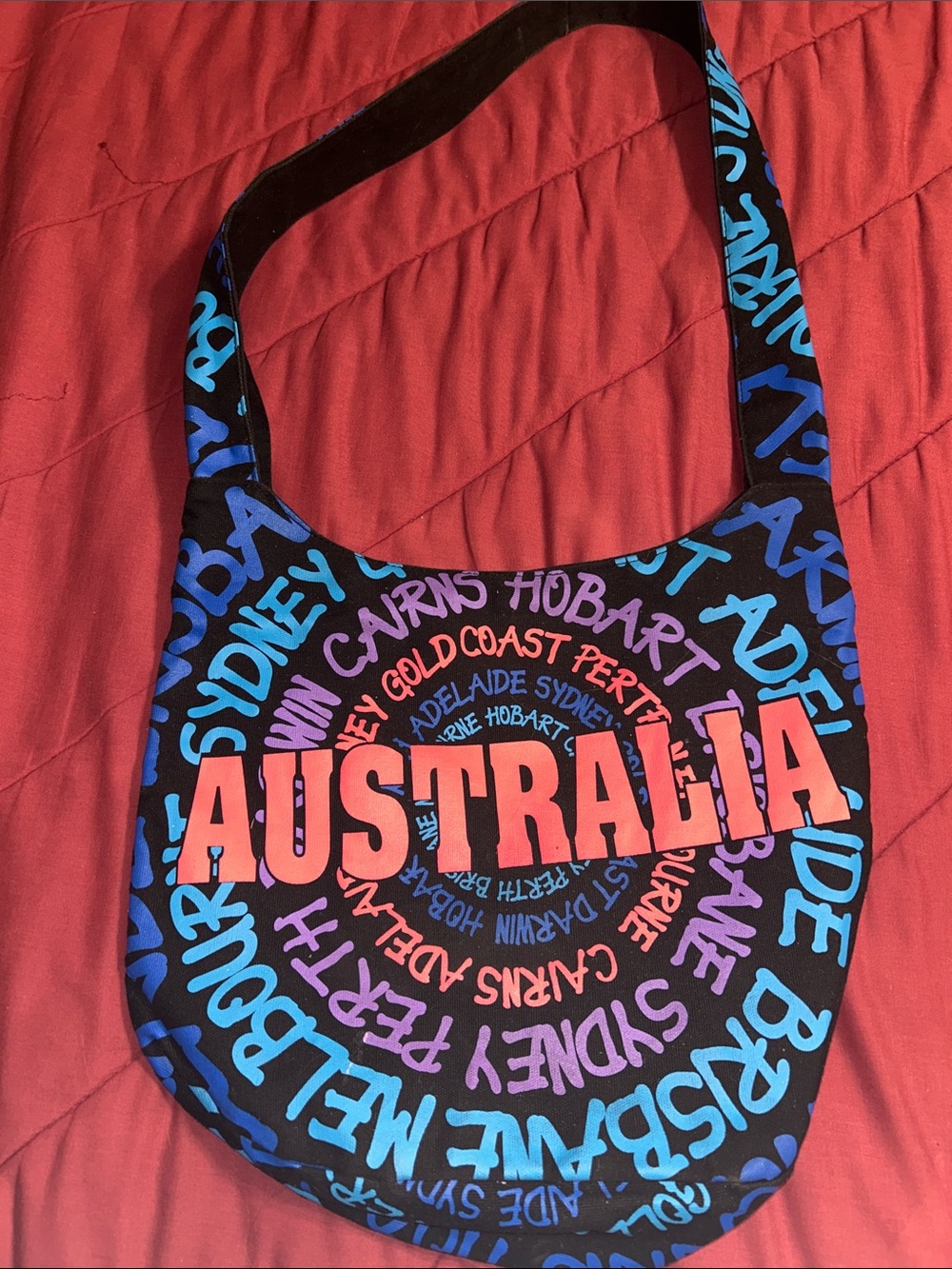 Robin Ruth Hobo Australia Graphic Black Crossbody Bag in Coral and Blue